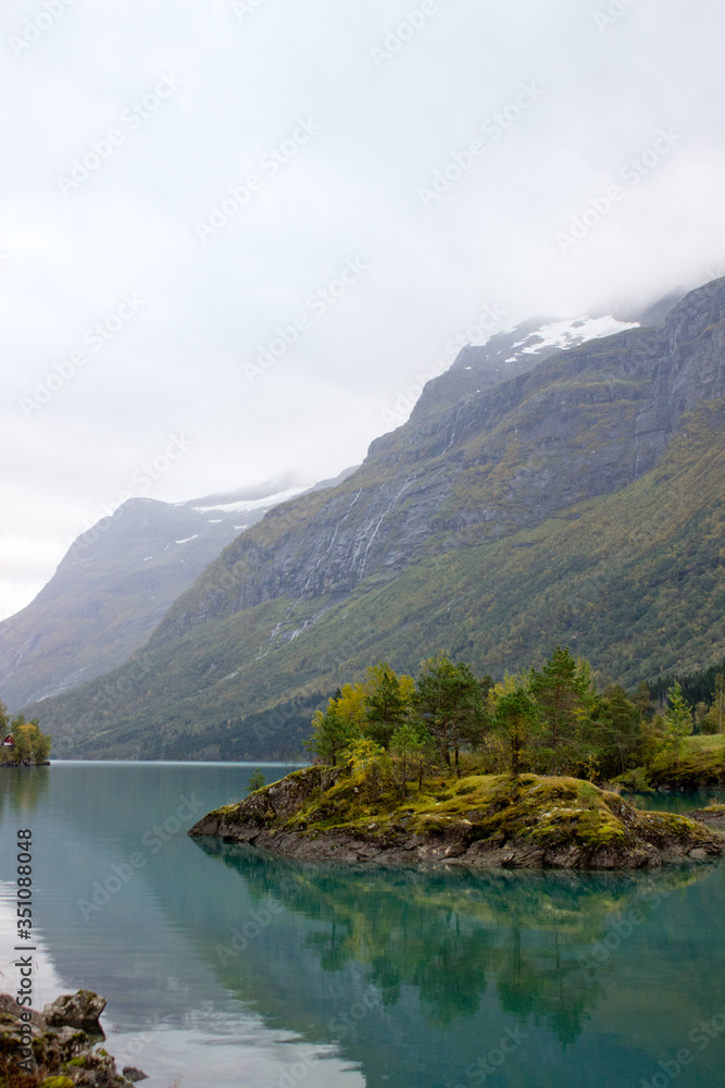 Beautiful norwegian landscape in autumn near Loen and Stryn in Norway.Lake with turquoise water surruonded by mountains.Lovatnet in autumn,photo for printing on calendar,poster,wallpaper,postcard