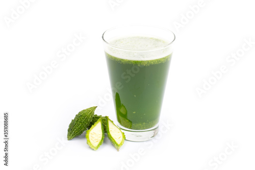 Herbal juice with bitter melon or bitter gourd isolated on white background.