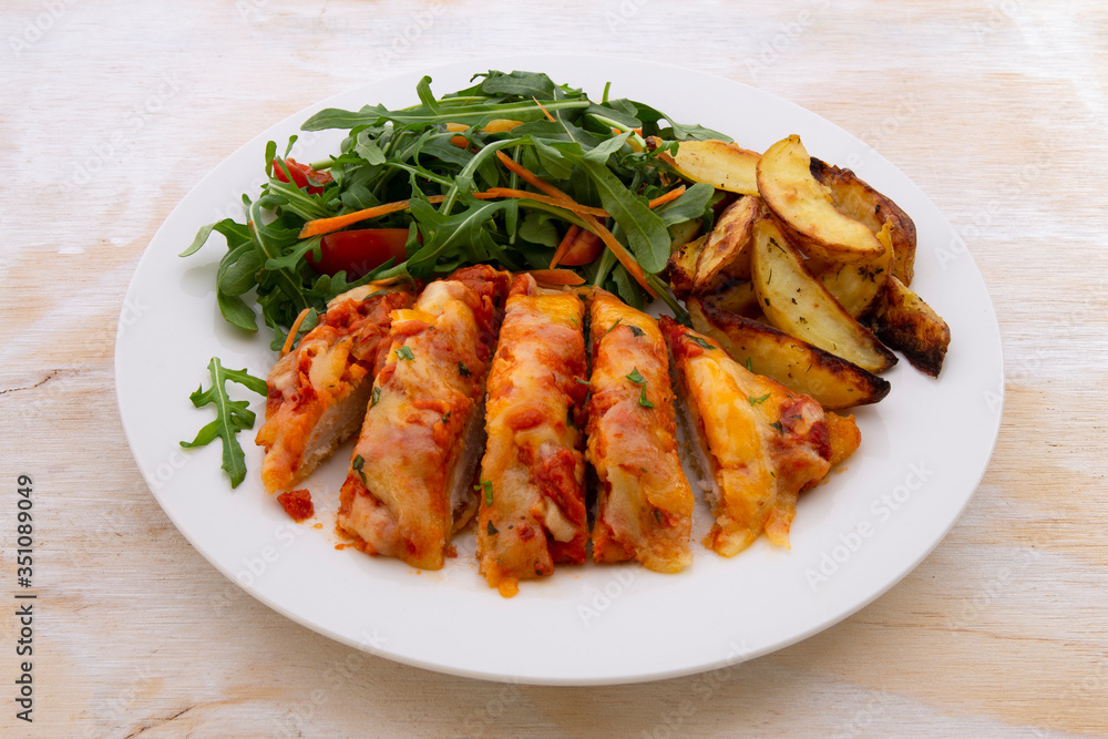 Chicken Parmesan Baked in Tomato Sauce with cheese, chips Chicken Parmesan Baked in Tomato Sauce with cheese, chips