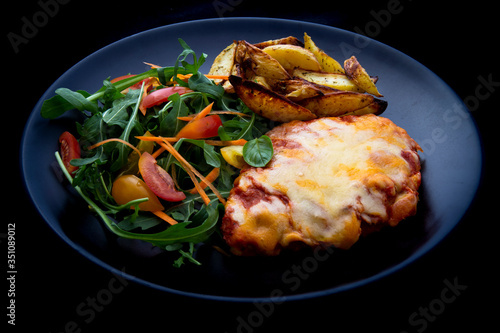 Chicken Parmesan Baked in Tomato Sauce with cheese, chips