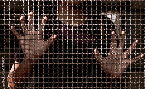 world refugee day, Woman hand holding on chain link fence ,human rights concept.