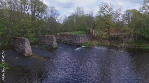 Remains of the watermill of fragments of Musninkai (Musninkeliai) manor homestead. 4K aerial dolly-in photo