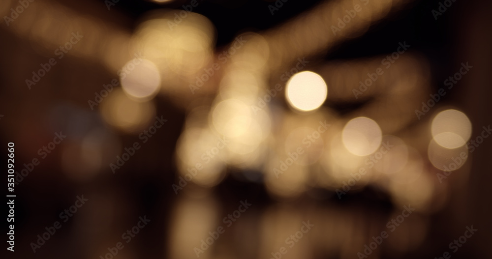 Abstract colorful defocused bokeh background. Blurred City street lights and reflections in rain at night. Abstract colorful defocused bokeh background. Blurred City street lights and reflections in rain at night.