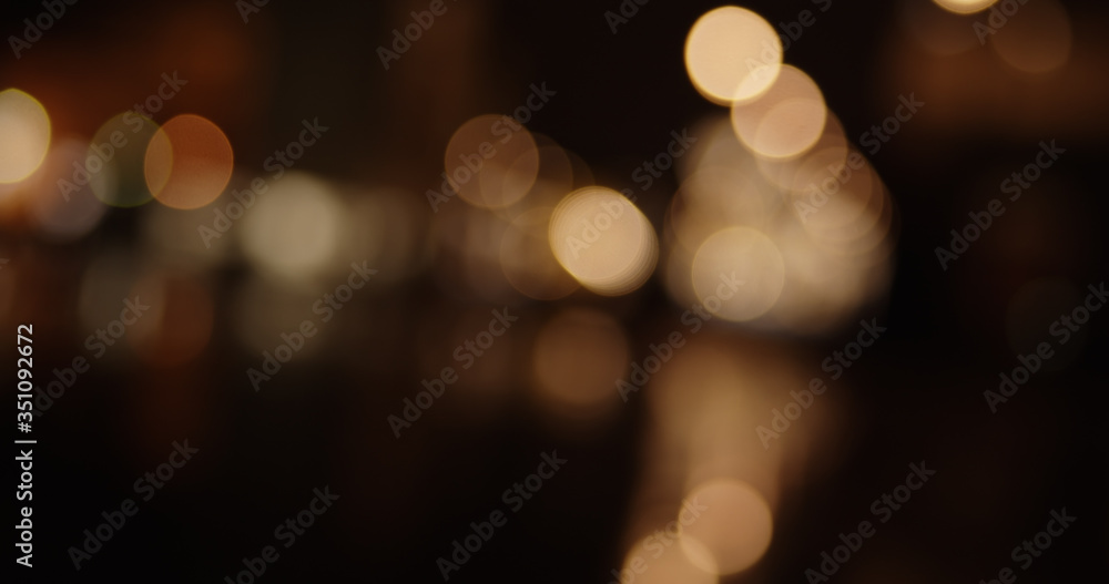 Abstract colorful defocused bokeh background. Blurred City street lights and reflections in rain at night. Abstract colorful defocused bokeh background. Blurred City street lights and reflections in rain at night.