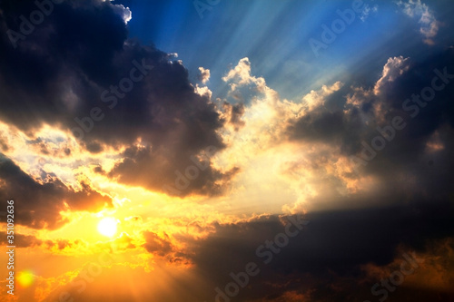 Beautiful evening sunset with clouds sky and sun rays