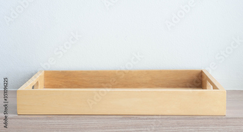 Empty wooden tray on table background © mraoraor