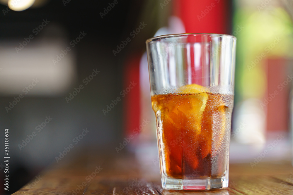 Iced cold brew coffee with slice of orange Iced cold brew coffee with slice of orange