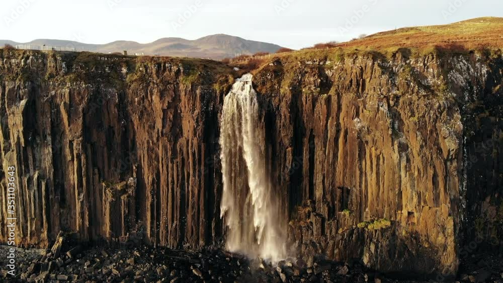 Aerial drone shot of Mealt Falls on Isle of Skye in Scotland. Waterfall falling into the ocean over a cliff edge Aerial drone shot of Mealt Falls on Isle of Skye in Scotland. Waterfall falling into the ocean over a cliff edge