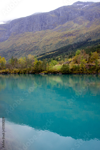 Beautiful norwegian landscape in autumn near Loen and Stryn in Norway.Lake with turquoise water surruonded by mountains.Lovatnet in autumn,photo for printing on calendar,poster,wallpaper,postcard