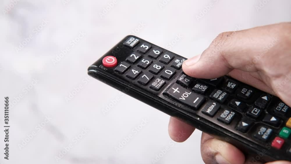 close up of man hand holding tv remote. close up of man hand holding tv remote.