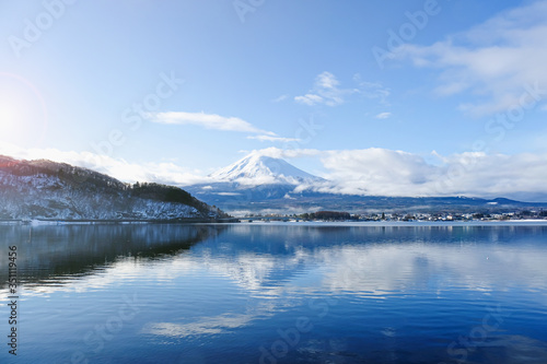 Scenic beautiful landscape view attraction famous landmark popular destination in Asia Mt Fuji in the early morning sunrise sunshine on the lake kawaguchiko in japan with bridge on winter season