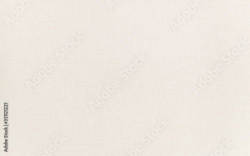 High quality artist canvas texture, macro shot with clear details. Clean surface. Natural ivory - cream colored, blank painting canvas.