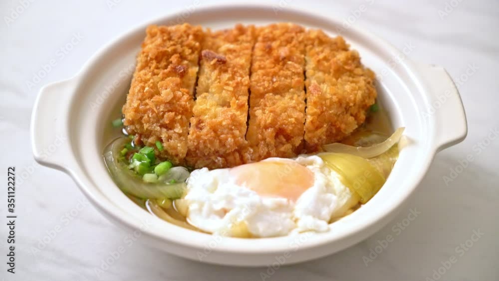 Japanese fried pork cutlet (katsudon) with onion soup and egg - Asian food style Japanese fried pork cutlet (katsudon) with onion soup and egg - Asian food style