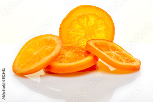 Slices Dried oranges or tangerines isolated on a white background. Vegetarianism and healthy eating.