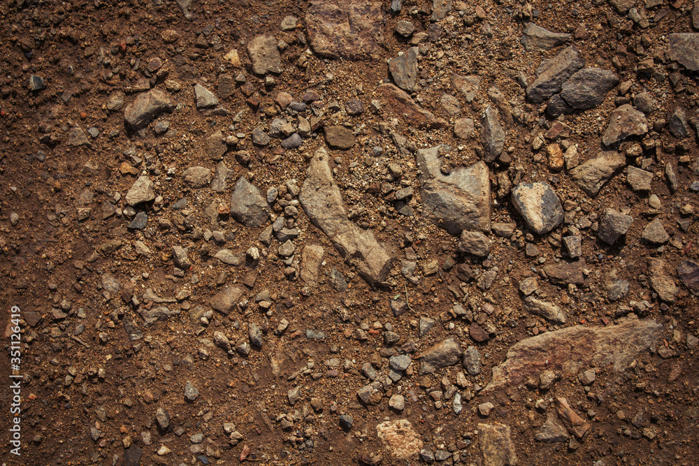 Soil background. Stony ground. Ground and stones. Crushed stones