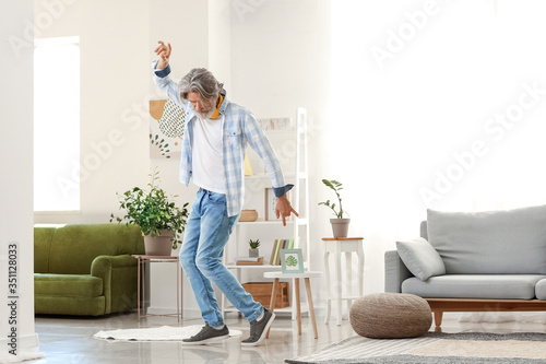 Cool senior man dancing at ...
