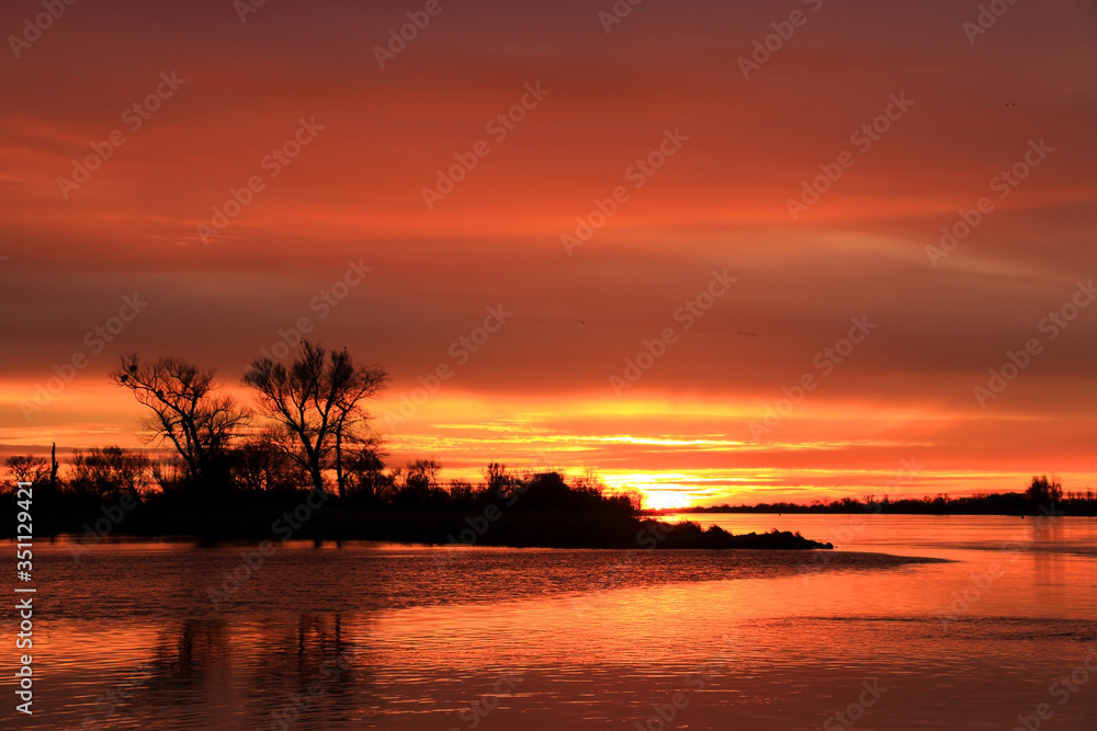 Colorful sunset by the Odra River, Germany.
