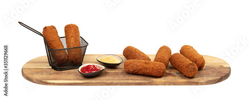 Brown crusty dutch kroketten on a serving tray isolated photo