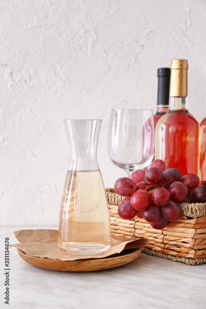 Decanter with bottles of wine on white background Decanter with bottles of wine on white background