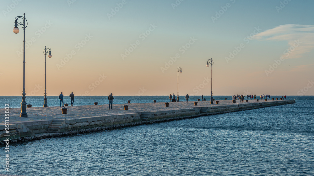 The Molo Audace pier of Trieste in a winter evening