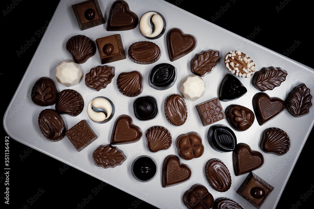 Traditional Turkish Candies designed on black surface with chocolate.Conceptual image of celebrations. Close-up chocolate. Religious Holiday, The Sugar Feast After Ramadan. Top view.
Traditional Turkish Candies designed on black surface with chocolate.Conceptual image of celebrations. Close-up chocolate. Religious Holiday, The Sugar Feast After Ramadan. Top view.