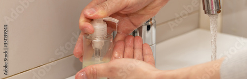 Man washing hands with soap and lathering suds. Protect against the coronavirus.