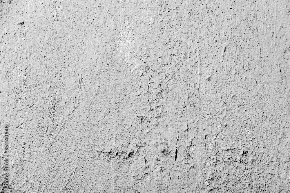 Texture of a concrete wall with cracks and scratches which can be used as a background Texture of a concrete wall with cracks and scratches which can be used as a background