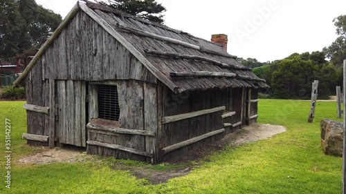 Old historical wooden cabin in the city of Melbourne, first settlers in Australia photo