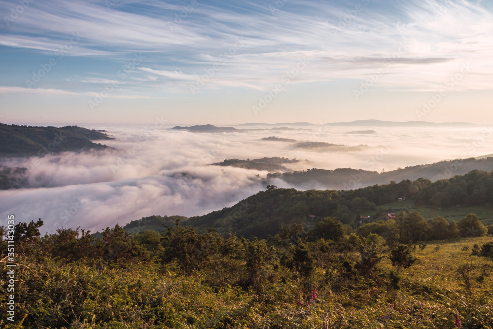 Landscape of a sea of clouds in the mountains of the north of Spain in a spring dawn during the sunrise