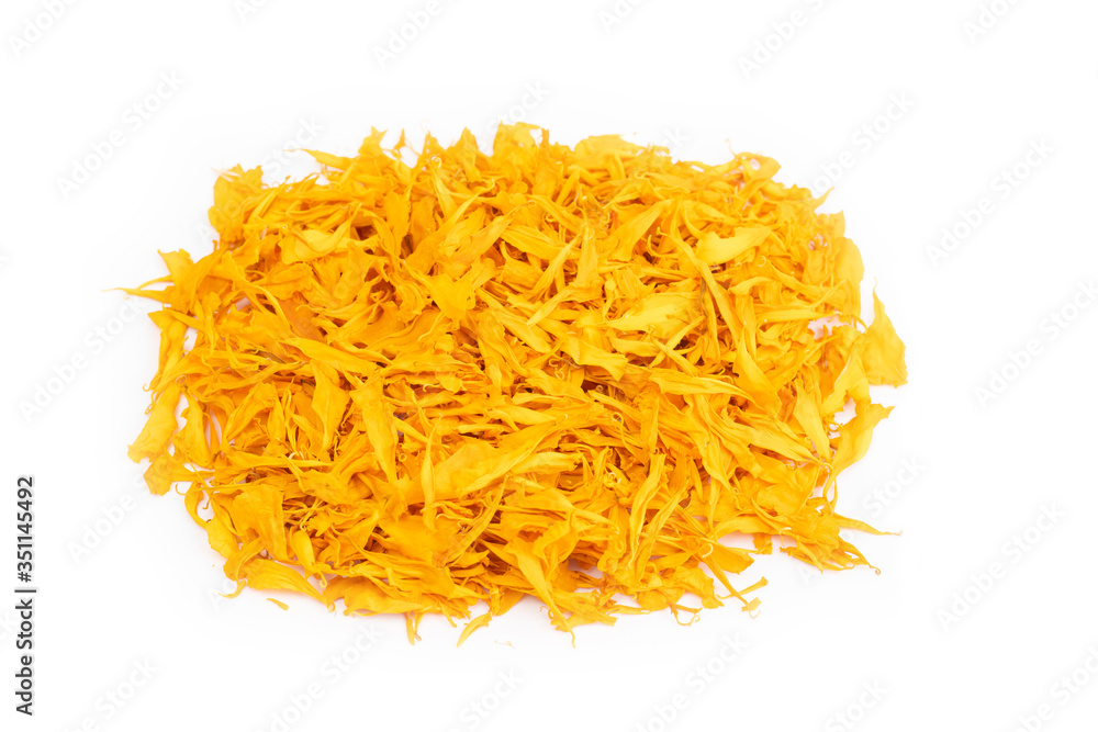 Fototapeta premium Dry marigold petal flowers isolated on white background. Herbal tea from flowers of a marigold