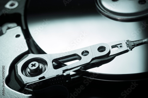 Wallpaper Mural Hard Disc Drive view from the inside with reflections. HDD internal parts. PC hardware. Open HDD. Torontodigital.ca