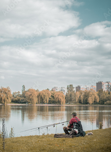Man fishing alone near lakeside.