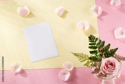 Letterhead mock-up with pastel concept. Blank objects for placing your design on light pink background, with rose leaf, leaves, yellow paper elements. nobody. Top view, flatlay (ID: 351148444)