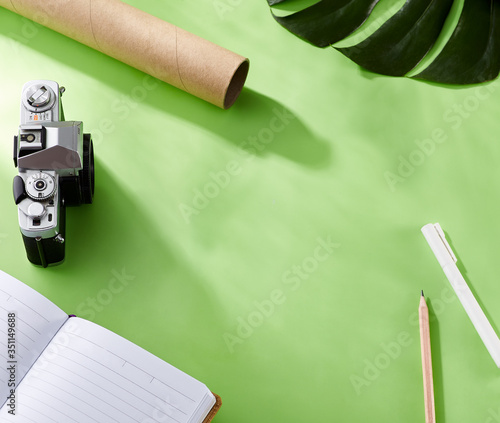 Product promotion showcase with pastel concept. Blank objects for placing your design on light green background, with book, pen, pencil, camera, leaves elements. nobody. Top view, flatlay. Hash light (ID: 351149688)