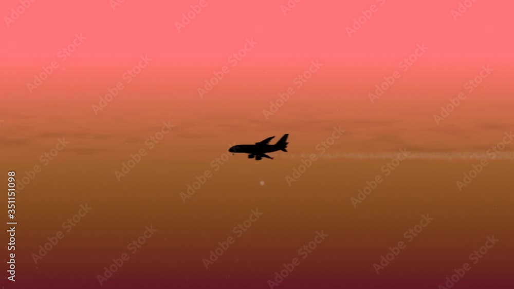 Airplane silhouette moving softly through heavenly beautiful sunny cloudscape. Airplane silhouette moving softly through heavenly beautiful sunny cloudscape.