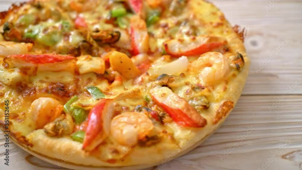 seafood (shrimps, octopus, mussel and crab) pizza on wood tray seafood (shrimps, octopus, mussel and crab) pizza on wood tray