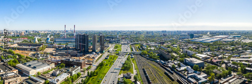 Aerial top view of road junction in Moscow from above, automobile traffic and the old Ugreshskaya railway station in the Moscow industrial zone near the automobile ring highway © miklyxa