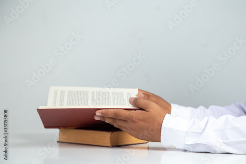  Businessman reading a book on a desk in the office, Concept: Business education to succeed that challenges teamwork, young student studying literature classic in the room college