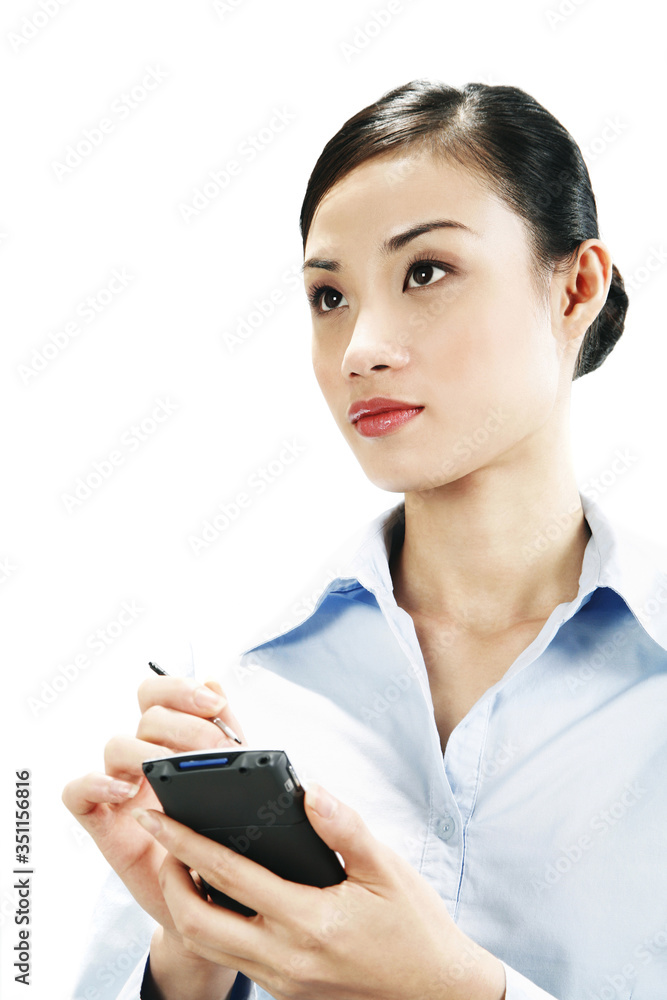 Businesswoman using palmtop Businesswoman using palmtop