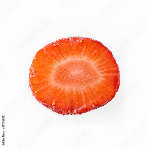 Isolated close up ripe red strawberry cut in half on a white background. Macro square image about fresh organic berries, harvets, healthy food and vitamin