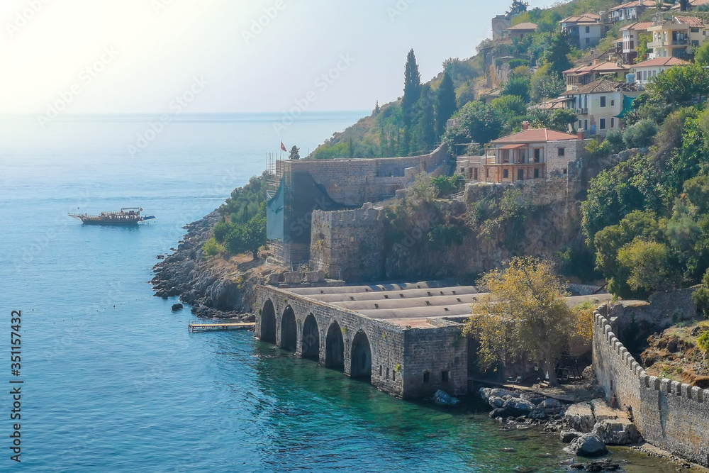 An old shipyard and the walls on the seashore in the center of Alanya