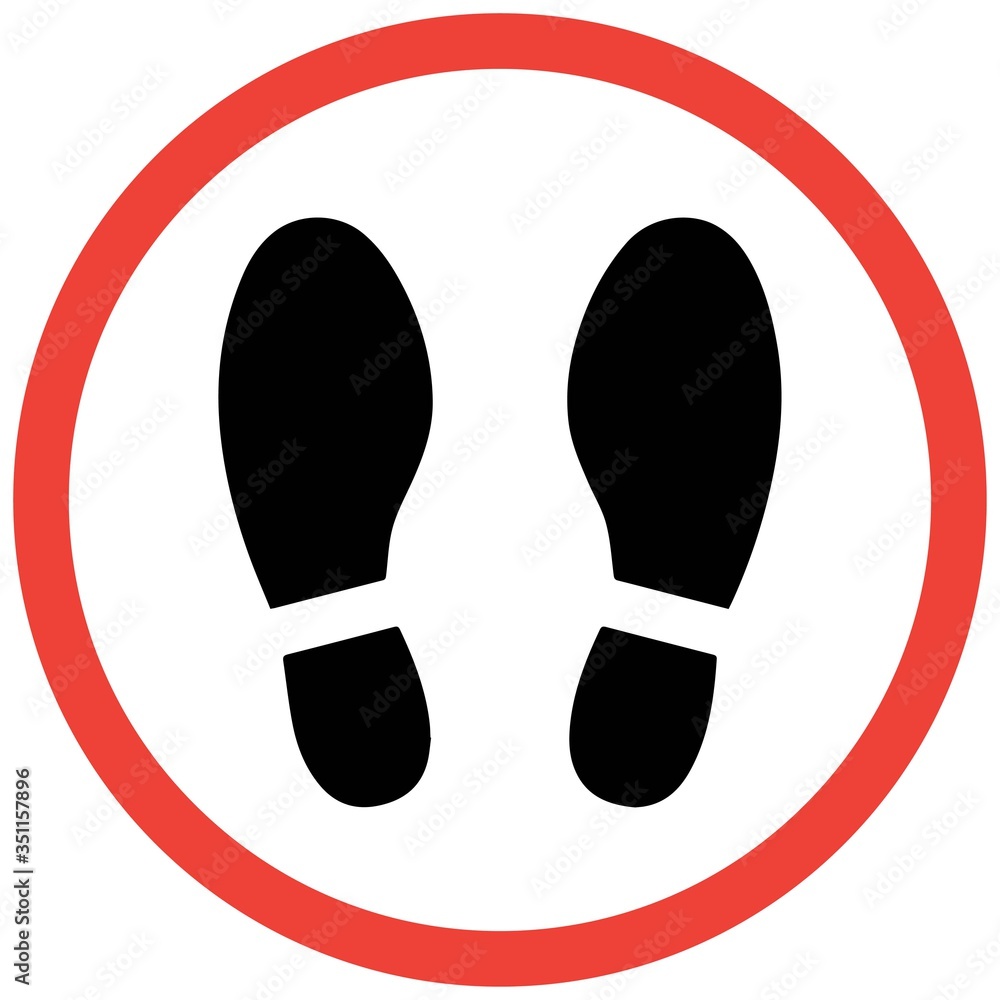 Social distancing concept for preventing coronavirus covid-19 with footprint stand here on circle with white border red background Social distancing concept for preventing coronavirus covid-19 with footprint stand here on circle with white border red background