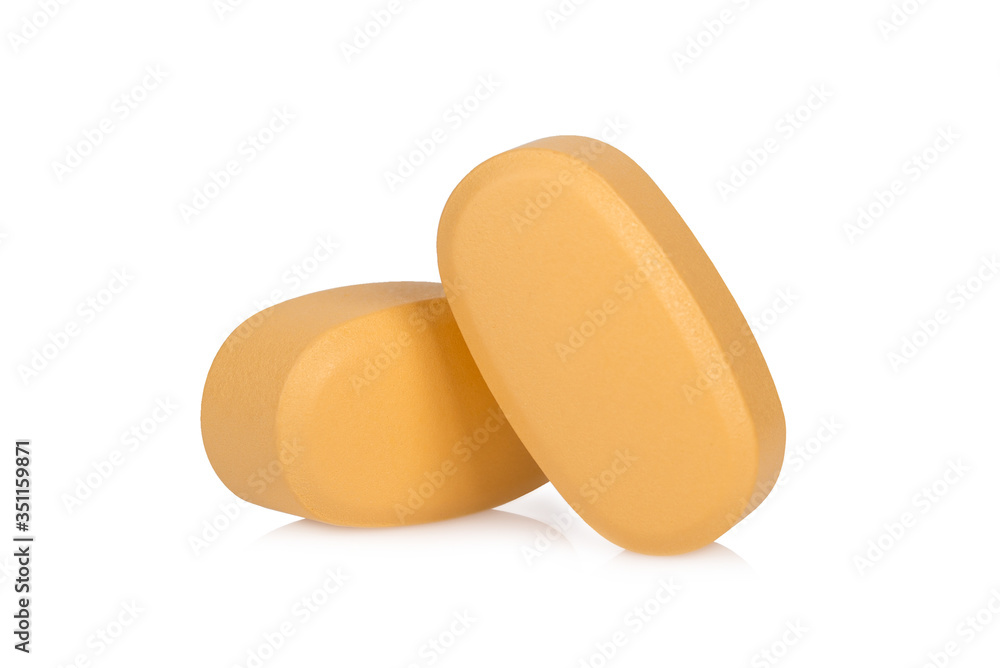 brown pills isolated on white background brown pills isolated on white background