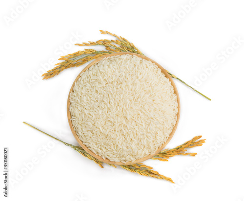 white rice (Thai Jasmine rice) in the wooden bowl and unmilled rice isolated on white background, top view