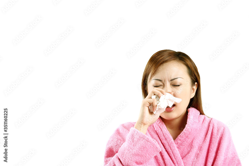 Woman holding tissue paper about to sneeze Woman holding tissue paper about to sneeze