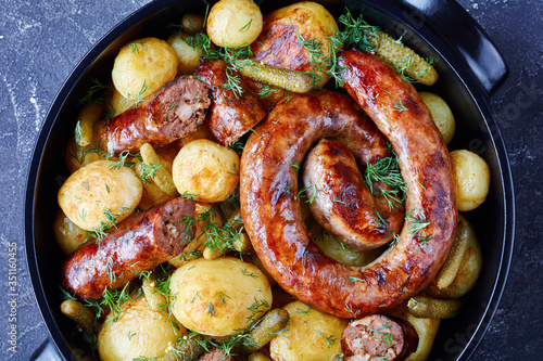 Roasted ring sausage, young potato and gherkins