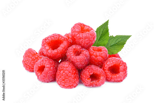 pile of fresh raspberry with leaf isolated on white background