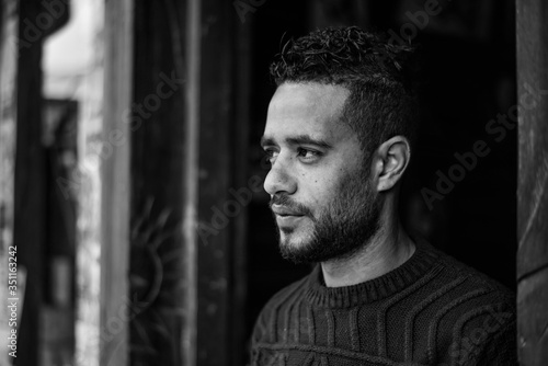fine black and white portrait of a chprismatic egyptian guy from Alexandria