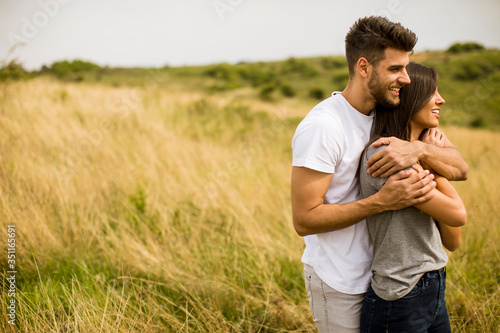 Young couple in love outside in spring nature