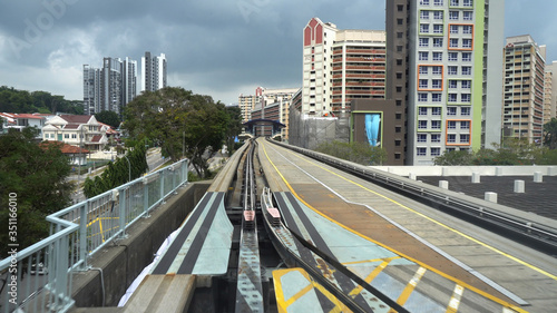 Photography Driverless LRT Train on Elevated Tracks in City of Singapore